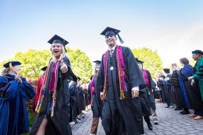 Class officers Diego Sanjuan and Bethany Perry lead the line of 2024 graduates