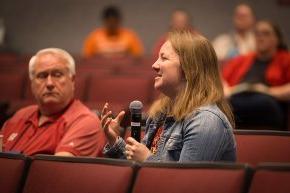 An LTSS alumna asks a question during the session in Belk Centrum