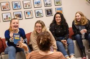 Melanie Mora participates in a game night with five international students