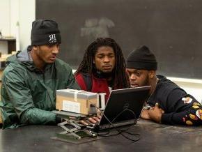 LR football players working in the engineering lab