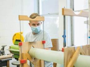 An LR student works on building a rocket