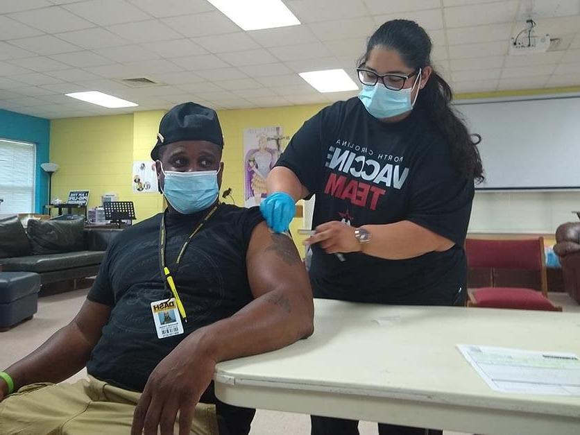 A man receives a vaccination.